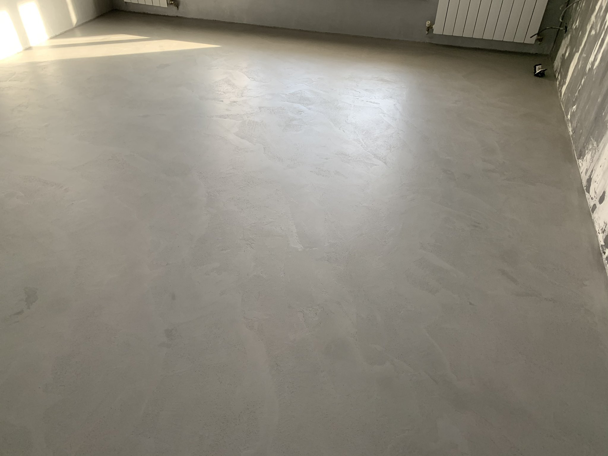 Layered Luxe light grey microcement flooring